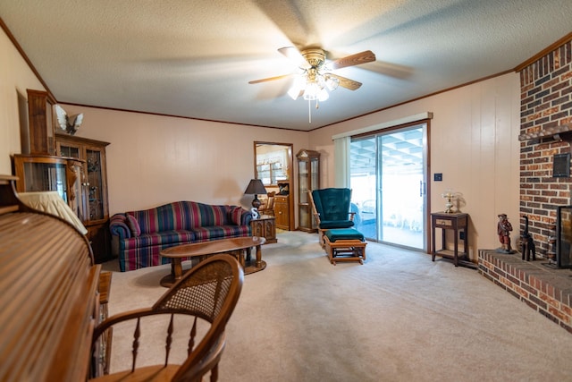 living room featuring ornamental molding, carpet flooring, a fireplace, and a textured ceiling