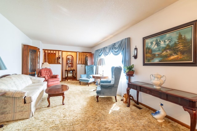 living area with carpet and baseboards