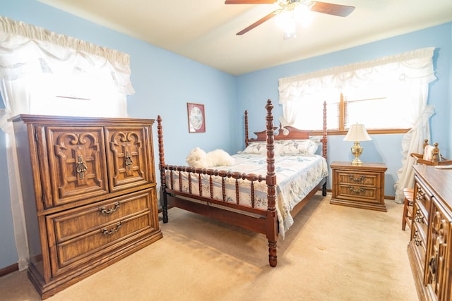 bedroom featuring light carpet and ceiling fan