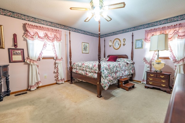 bedroom with carpet flooring, visible vents, and baseboards