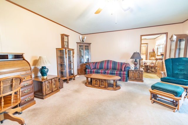 carpeted living area with a ceiling fan and crown molding