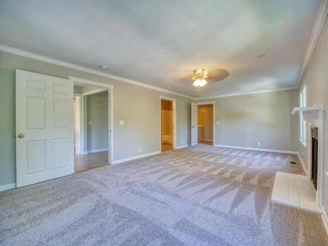 unfurnished living room with ceiling fan, ornamental molding, and light carpet