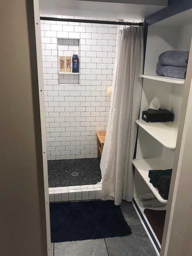 bathroom with tile patterned flooring and a shower with curtain