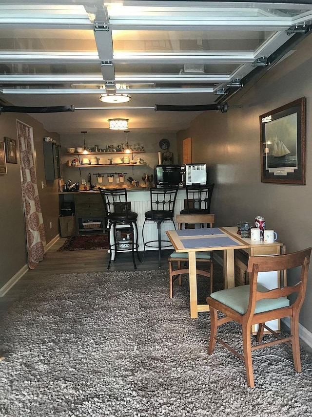 dining area with dark hardwood / wood-style flooring