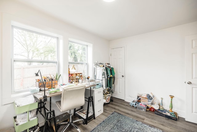 home office with dark wood-type flooring