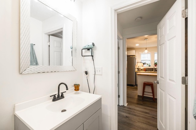 bathroom featuring vanity and wood finished floors