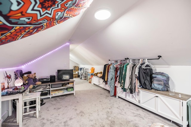 interior space with light colored carpet and vaulted ceiling