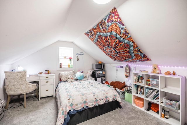 bedroom with vaulted ceiling and carpet