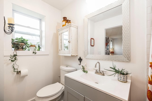 bathroom featuring vanity and toilet