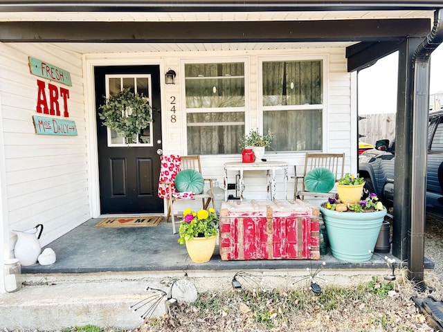 doorway to property featuring a porch