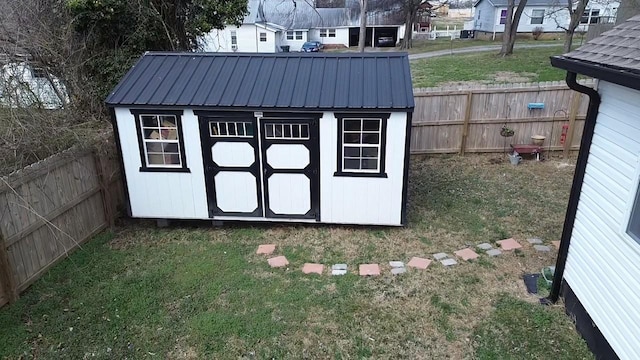 view of shed featuring a fenced backyard