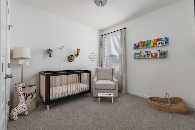 carpeted bedroom with a crib