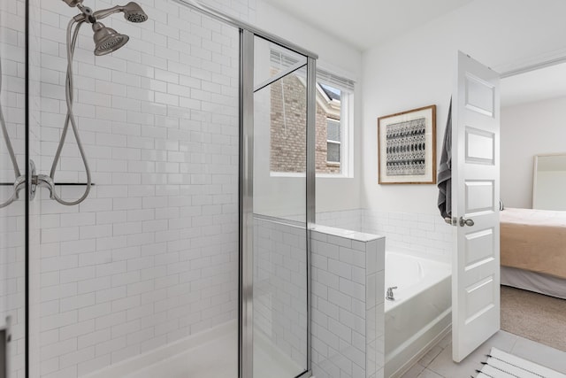 bathroom featuring tile patterned flooring and plus walk in shower