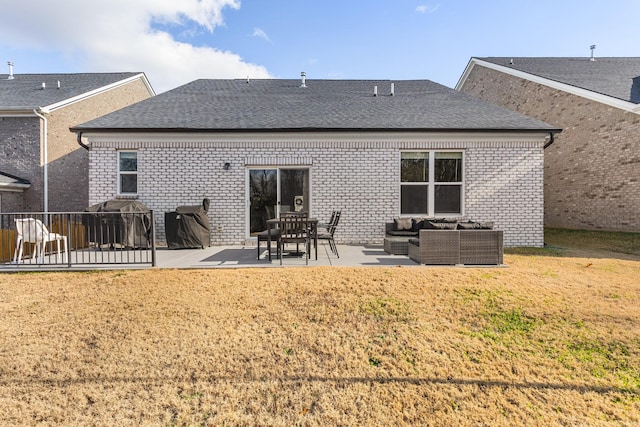 back of property featuring an outdoor living space, a yard, and a patio