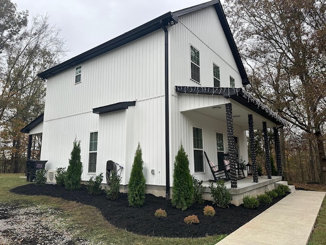 view of side of home featuring a porch