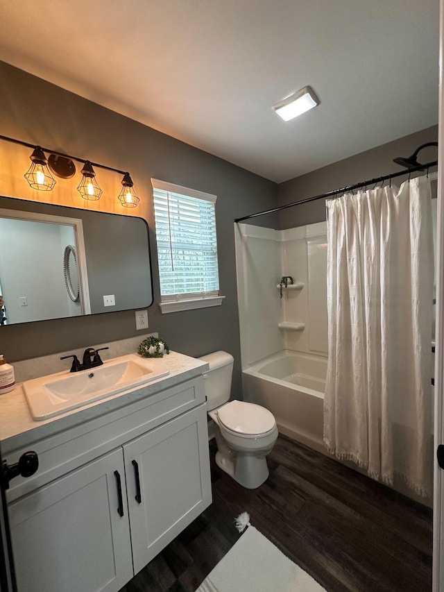 full bathroom featuring vanity, toilet, shower / bath combination with curtain, and hardwood / wood-style flooring