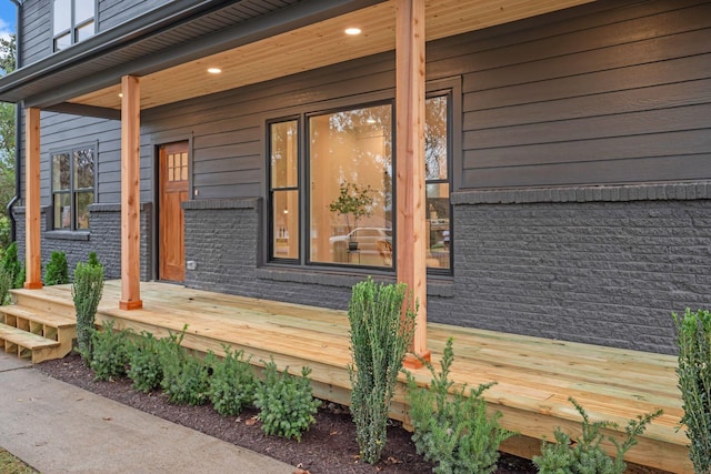 property entrance featuring covered porch