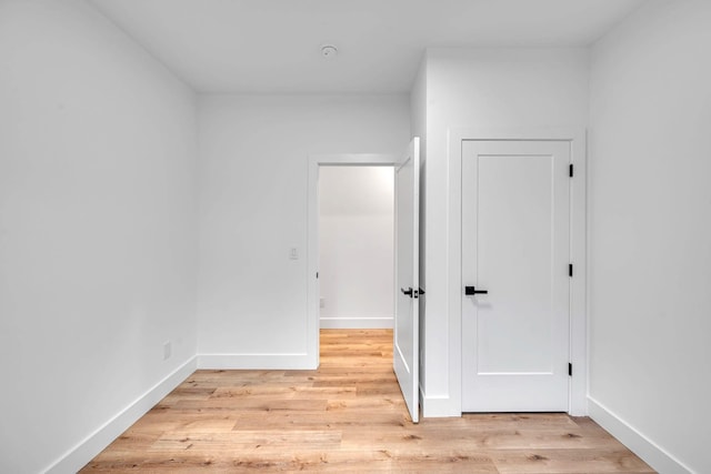 hall with light hardwood / wood-style flooring