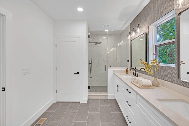 bathroom with vanity, tile patterned floors, and an enclosed shower