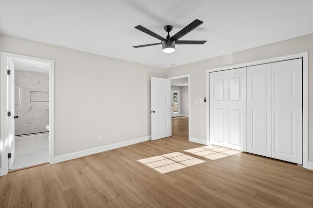 unfurnished bedroom featuring connected bathroom, ceiling fan, a closet, and light hardwood / wood-style floors