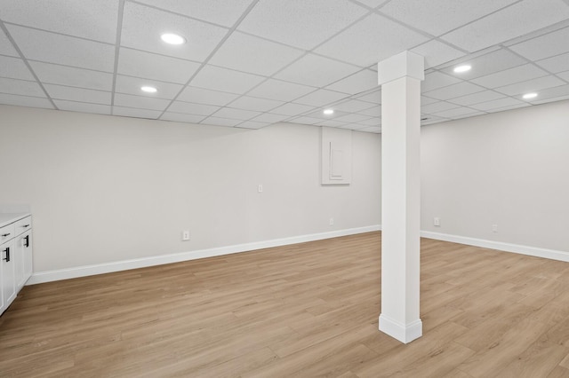 basement with light hardwood / wood-style floors