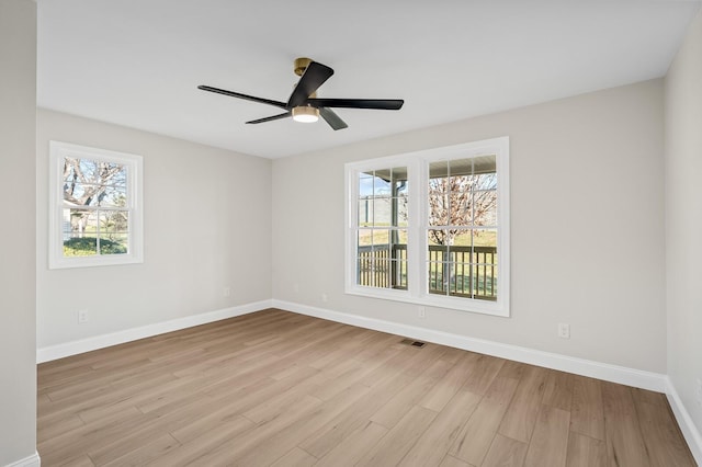 unfurnished room featuring ceiling fan and light hardwood / wood-style floors