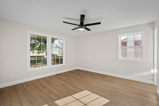 spare room with ceiling fan and light hardwood / wood-style floors