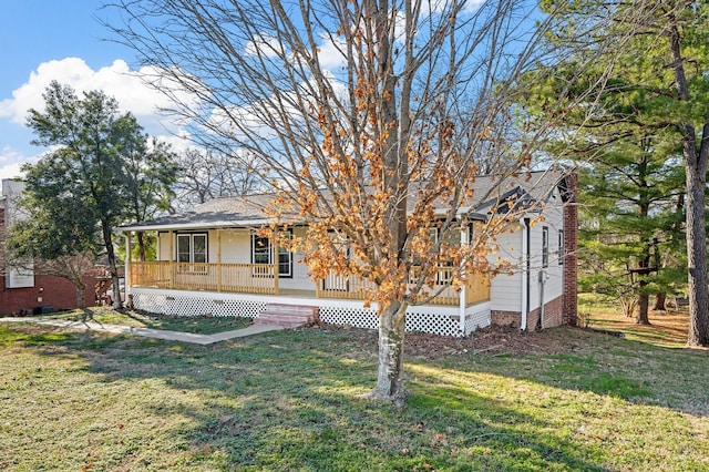 view of front of house with a porch and a front yard