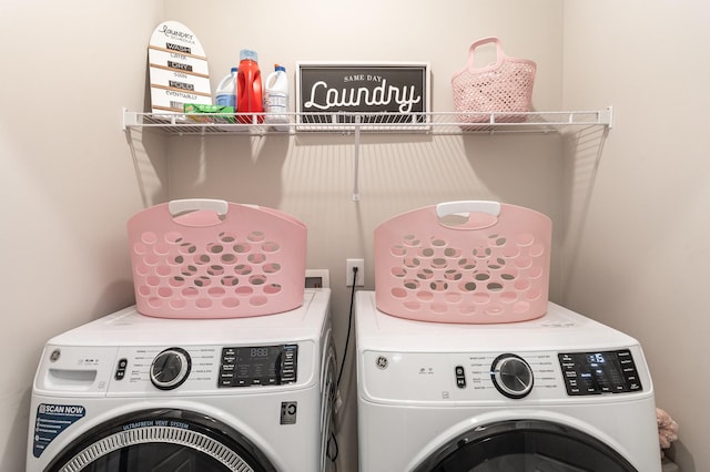 clothes washing area with independent washer and dryer