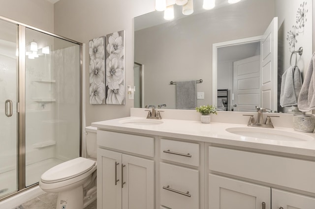 bathroom featuring toilet, tile patterned floors, walk in shower, and vanity