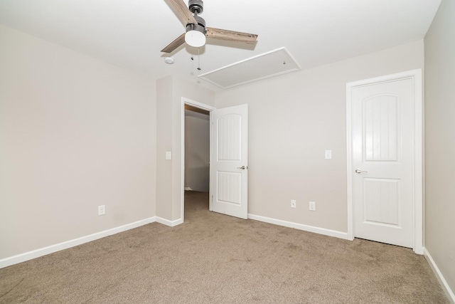 unfurnished bedroom featuring ceiling fan and light colored carpet