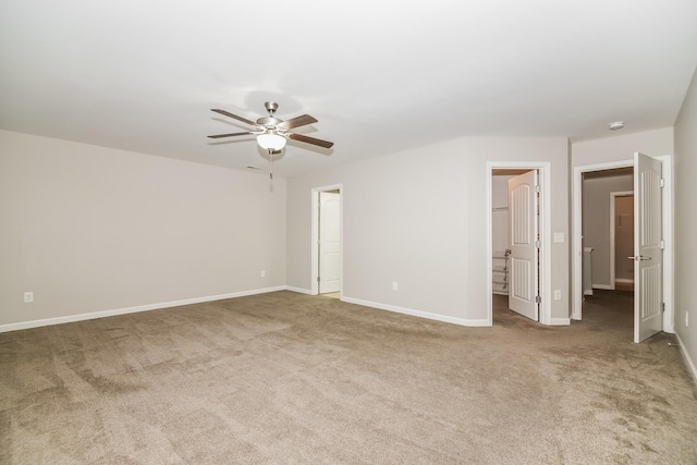 empty room with carpet flooring and ceiling fan