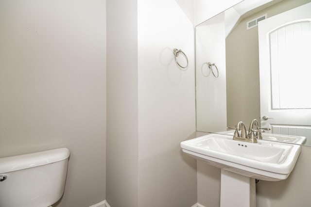 bathroom featuring sink and toilet