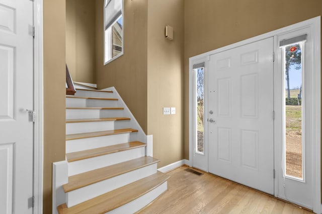 foyer with light hardwood / wood-style floors