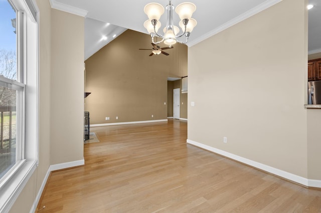 unfurnished living room featuring a chandelier, light hardwood / wood-style flooring, high vaulted ceiling, and ornamental molding