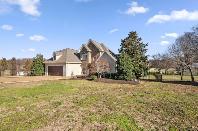 view of front of home featuring a garage and a front lawn