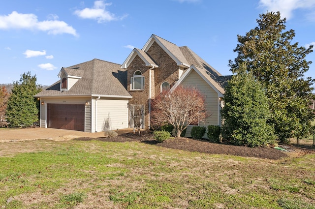 front facade featuring a garage and a front lawn