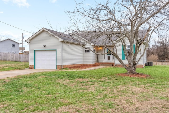 view of front of property featuring cooling unit, a front yard, and a garage