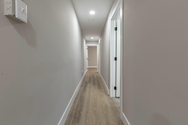 hall with light hardwood / wood-style flooring