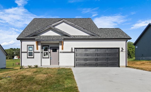 view of front of property with a garage and a front yard