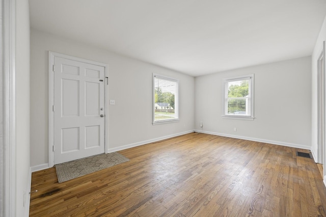 entryway with hardwood / wood-style flooring