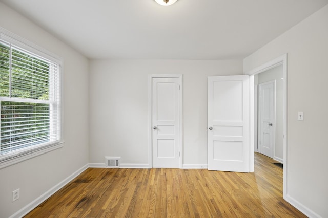 unfurnished bedroom with light hardwood / wood-style flooring