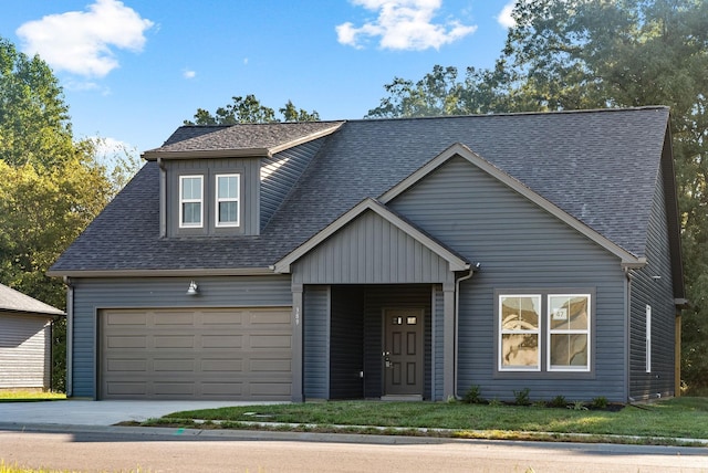 view of front facade with a front lawn and a garage