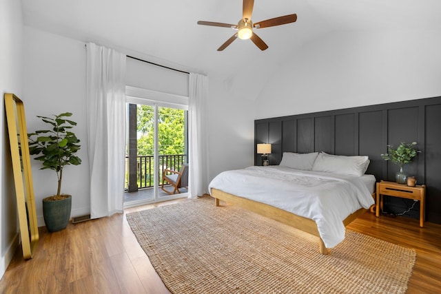 bedroom featuring access to exterior, light hardwood / wood-style flooring, ceiling fan, and lofted ceiling