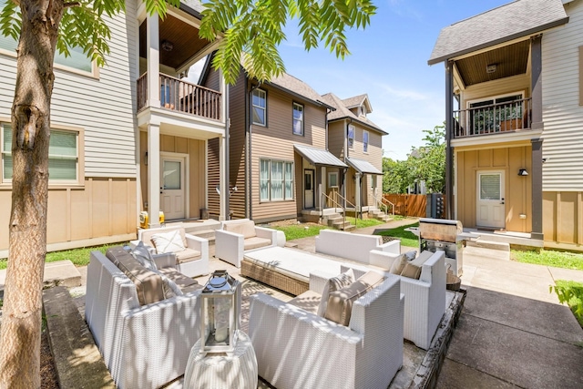 view of patio / terrace with an outdoor hangout area and a balcony