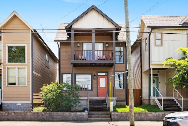 view of front of property with a balcony