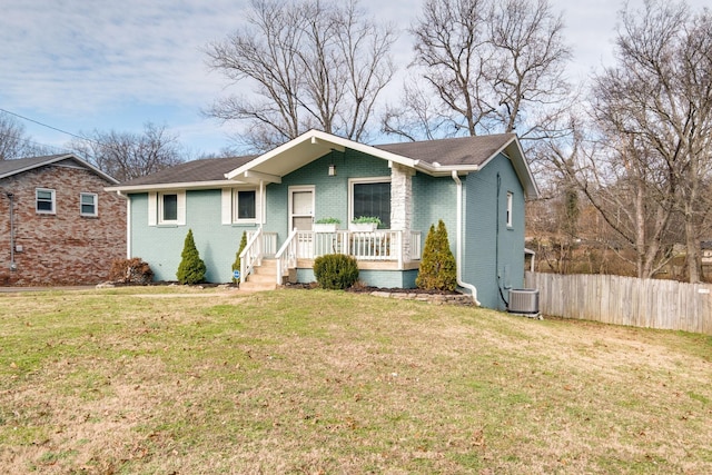 single story home with a front lawn and central AC unit