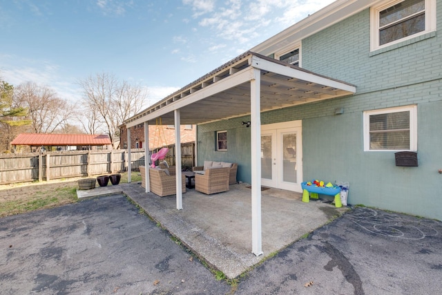 view of patio / terrace featuring an outdoor living space and french doors