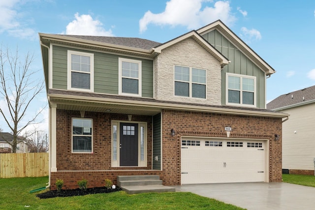 craftsman house featuring a front yard and a garage