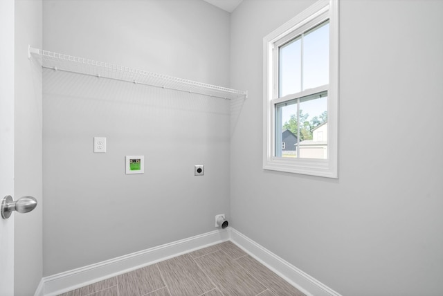 washroom featuring washer hookup and electric dryer hookup